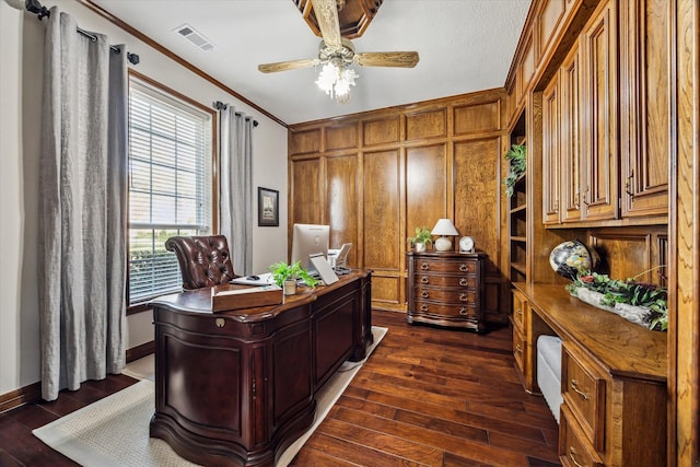 office area featuring ceiling fan, dark hardwood / wood-style floors, and ornamental molding