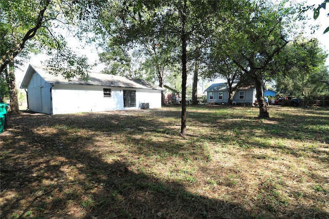 view of yard with central air condition unit