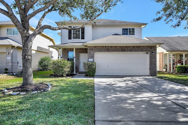 view of front of property featuring a garage and a front yard