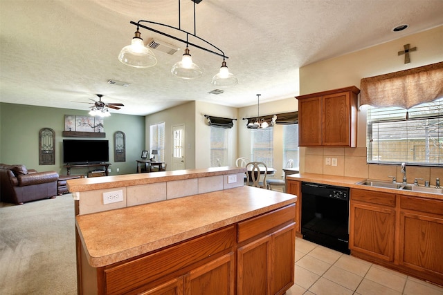 kitchen featuring dishwasher, sink, decorative backsplash, hanging light fixtures, and a center island