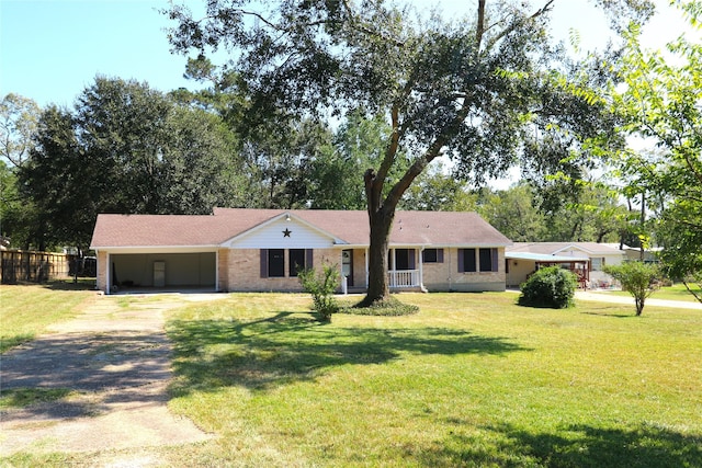 single story home featuring a front yard and a carport