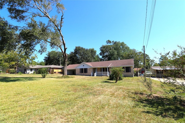 ranch-style house featuring a front lawn and a porch