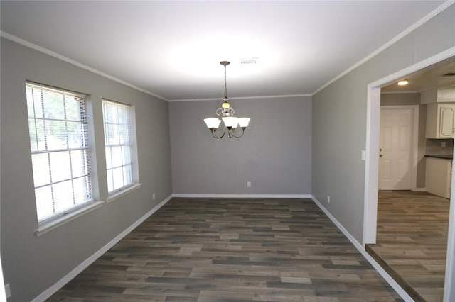 unfurnished dining area with dark wood-type flooring, a chandelier, and crown molding