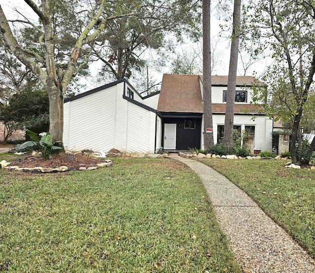 view of front of property with a front lawn