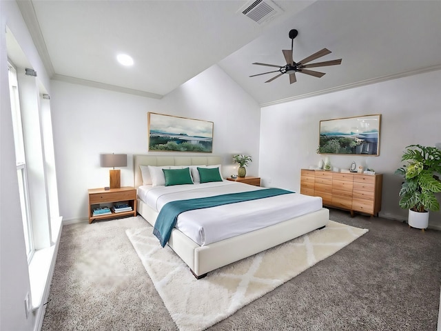 bedroom with ceiling fan, carpet, vaulted ceiling, crown molding, and multiple windows