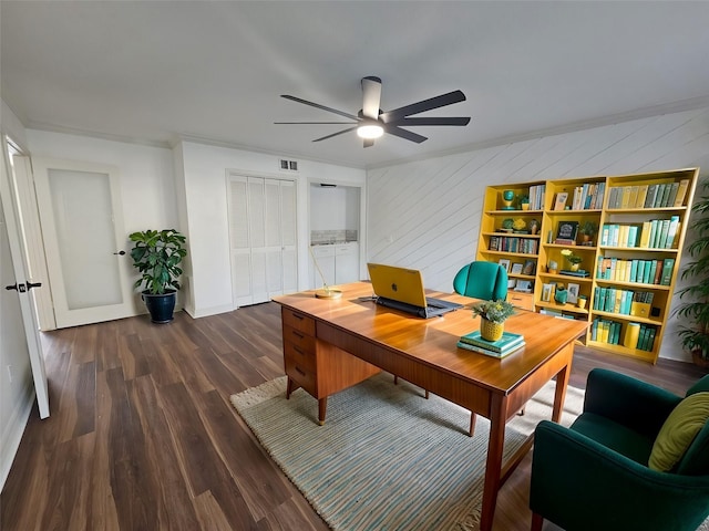 office with ceiling fan, dark hardwood / wood-style flooring, crown molding, and wooden walls