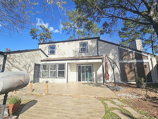 back of property featuring a patio