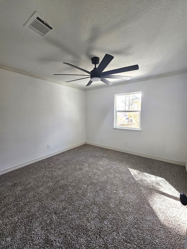 carpeted spare room with ceiling fan, crown molding, and a textured ceiling