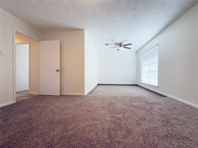 carpeted empty room featuring a textured ceiling and ceiling fan