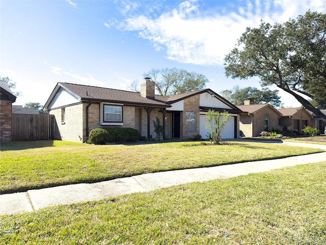 single story home featuring a front lawn and a garage