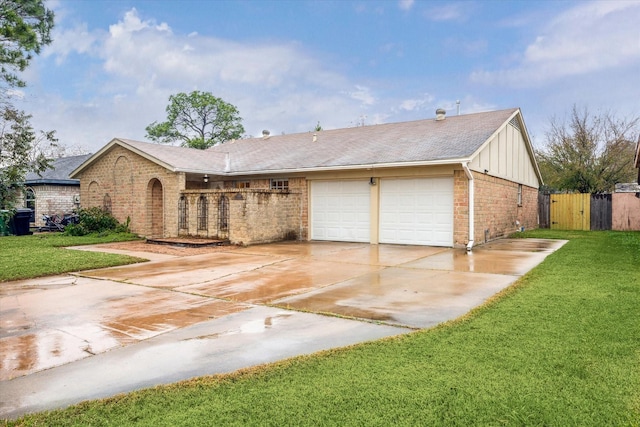 ranch-style house featuring a front lawn and a garage