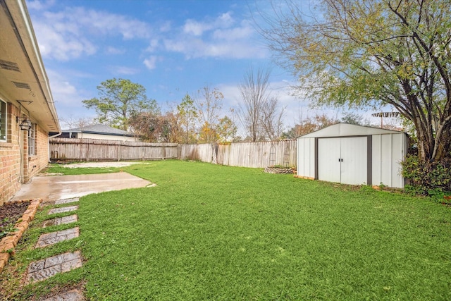 view of yard with a shed and a patio