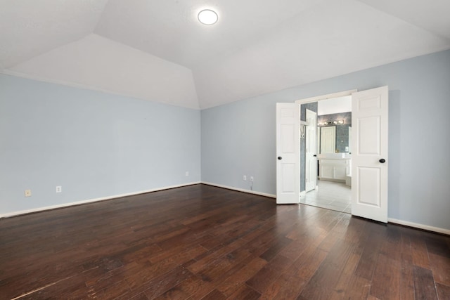 interior space with lofted ceiling and hardwood / wood-style flooring