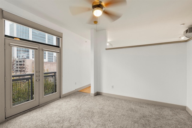 spare room with ceiling fan and carpet floors