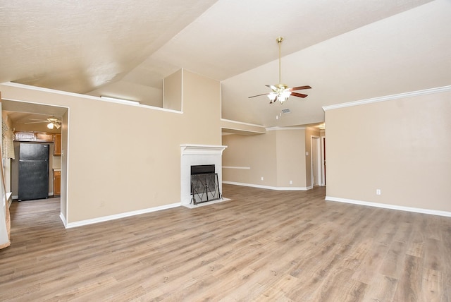 unfurnished living room with light hardwood / wood-style floors and lofted ceiling