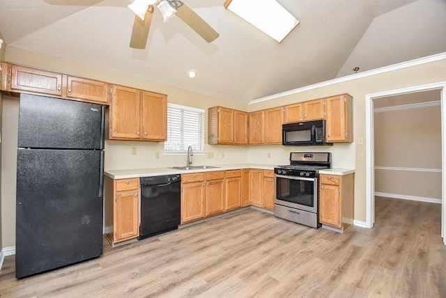 kitchen featuring black appliances, ceiling fan, sink, and lofted ceiling