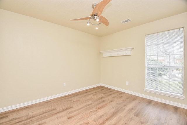 spare room featuring light hardwood / wood-style floors and ceiling fan