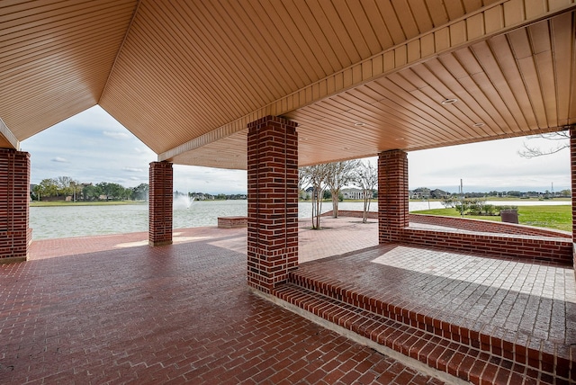 view of patio with a water view