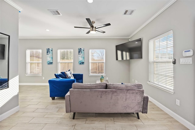 living room with ceiling fan and crown molding