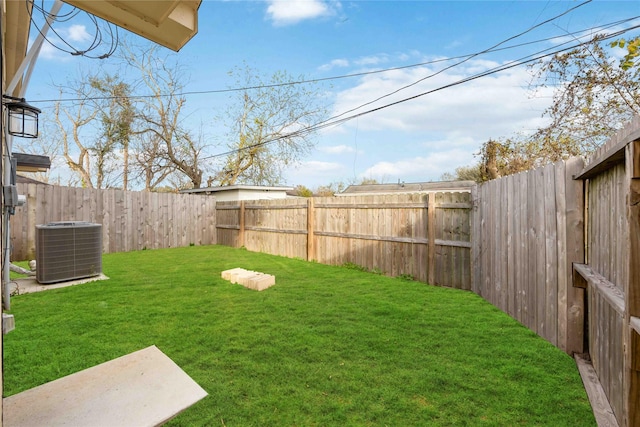 view of yard with central AC unit