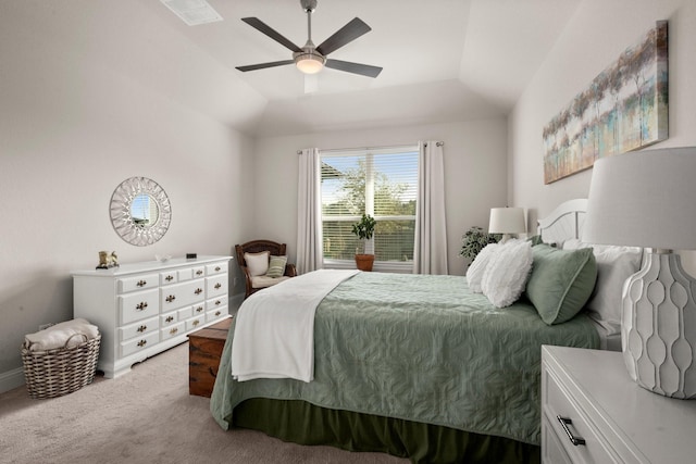 carpeted bedroom featuring ceiling fan and vaulted ceiling