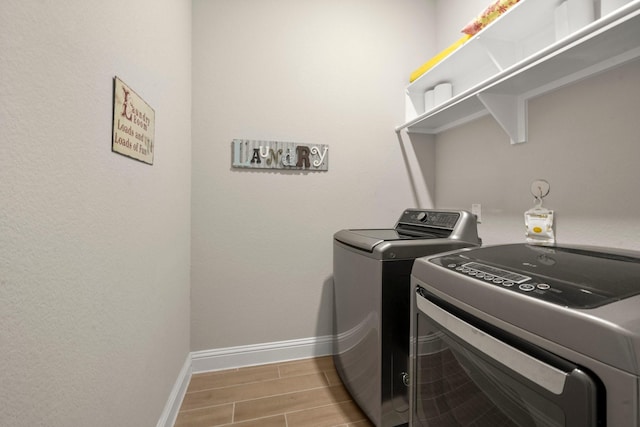 washroom featuring washing machine and dryer