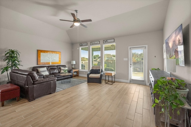 living room with ceiling fan and lofted ceiling