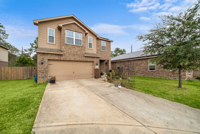 view of front of house featuring a front yard and a garage