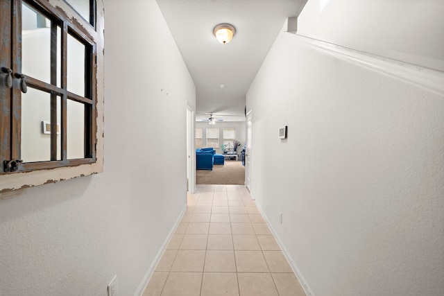 corridor with light tile patterned floors