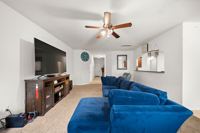 living room featuring ceiling fan and light colored carpet