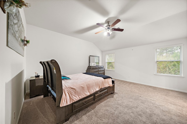 carpeted bedroom featuring vaulted ceiling and ceiling fan