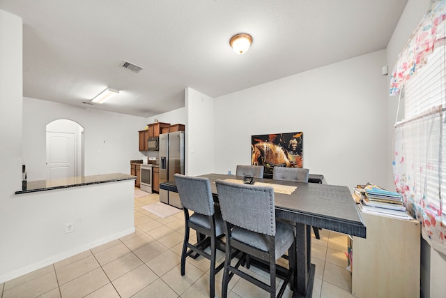 view of tiled dining space