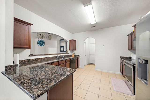 kitchen featuring stainless steel range with electric cooktop, kitchen peninsula, dishwasher, a textured ceiling, and sink