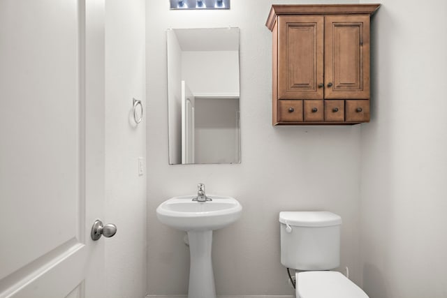 bathroom featuring toilet