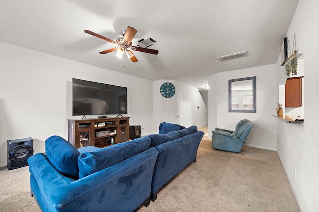 living room featuring ceiling fan and light colored carpet