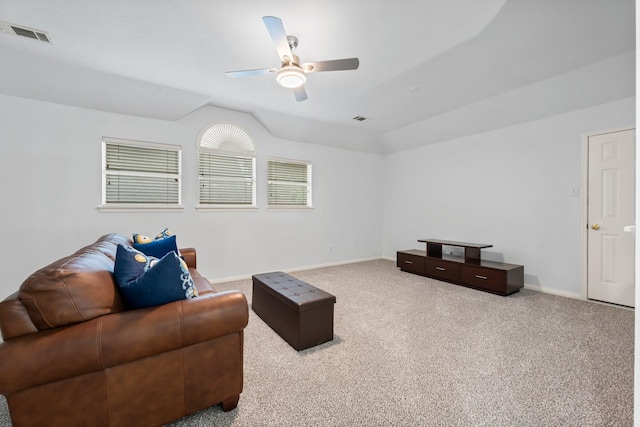 carpeted living room with lofted ceiling and ceiling fan