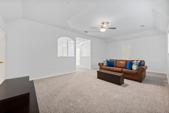 living room with ceiling fan, light colored carpet, and vaulted ceiling