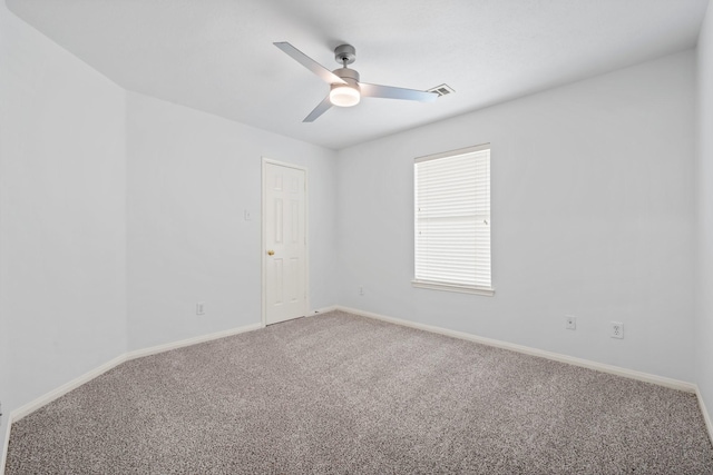 spare room with carpet floors and ceiling fan