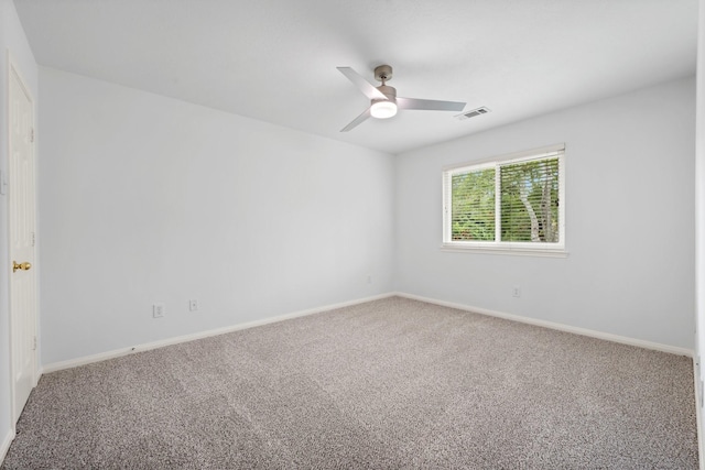 carpeted empty room with ceiling fan