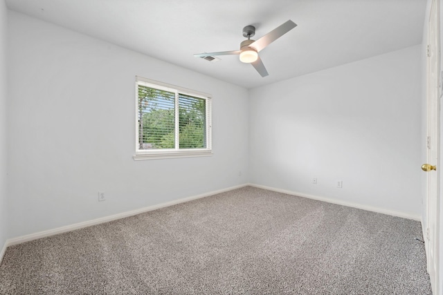 unfurnished room with ceiling fan and carpet flooring