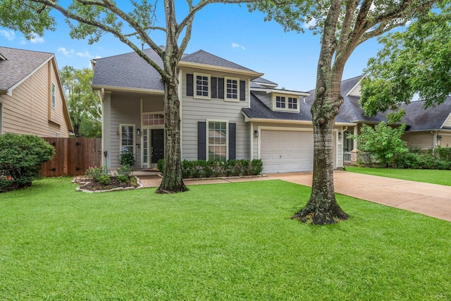 view of front of home featuring a garage and a front yard