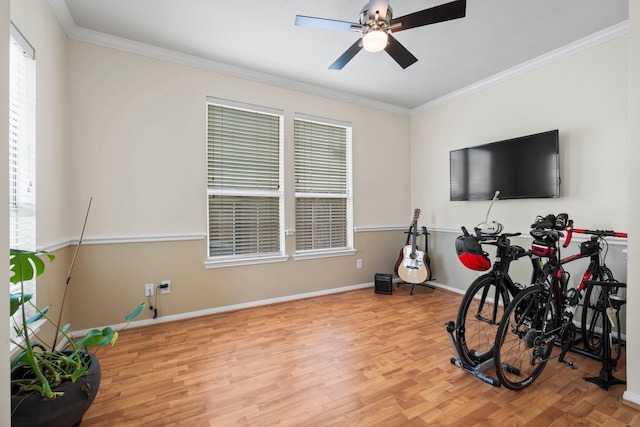 misc room with ceiling fan, ornamental molding, and hardwood / wood-style flooring