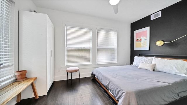 bedroom featuring ceiling fan and dark wood-type flooring