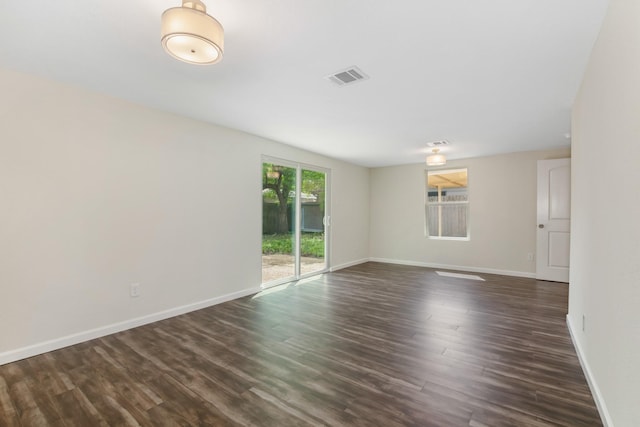 empty room with dark hardwood / wood-style floors