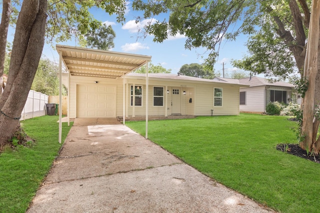 ranch-style home featuring a front yard, a carport, and a garage