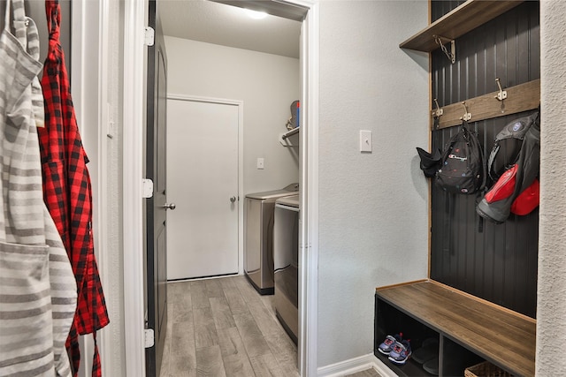 interior space featuring washing machine and dryer and light wood-type flooring