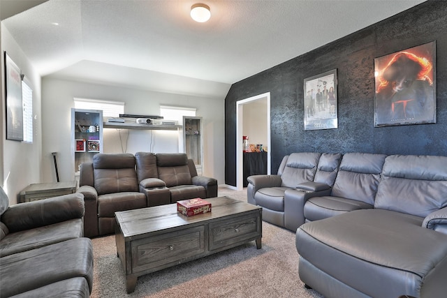 carpeted living room featuring lofted ceiling