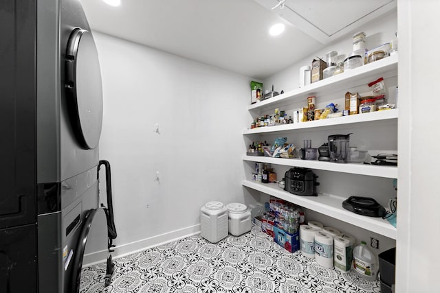 pantry with stacked washer and dryer