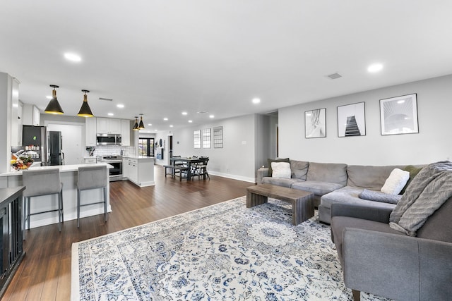 living room with dark wood-type flooring