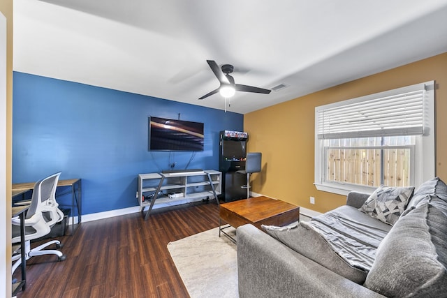 living room with ceiling fan and dark hardwood / wood-style floors